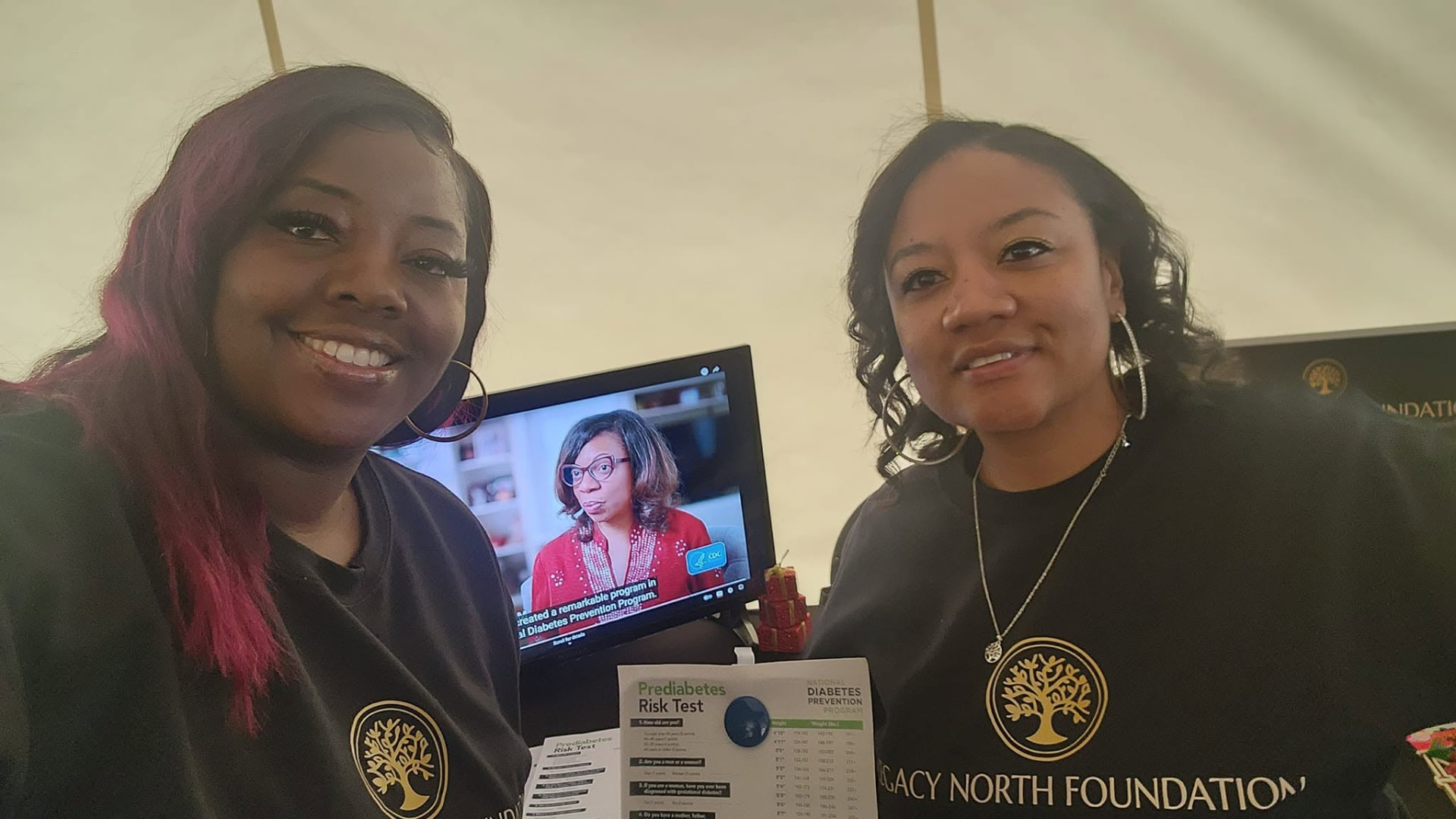 Legacy North Foundation volunteers sharing health resources with attendees