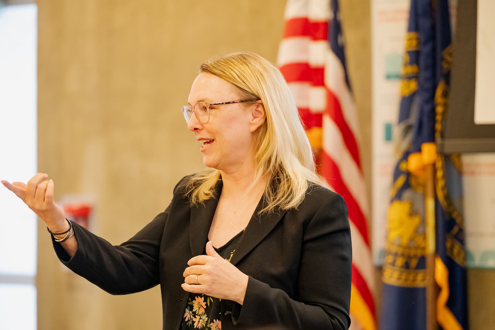 A professional presenting on financial topics to attendees